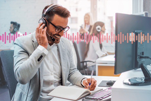 A sales agent talking to a customer on a headset